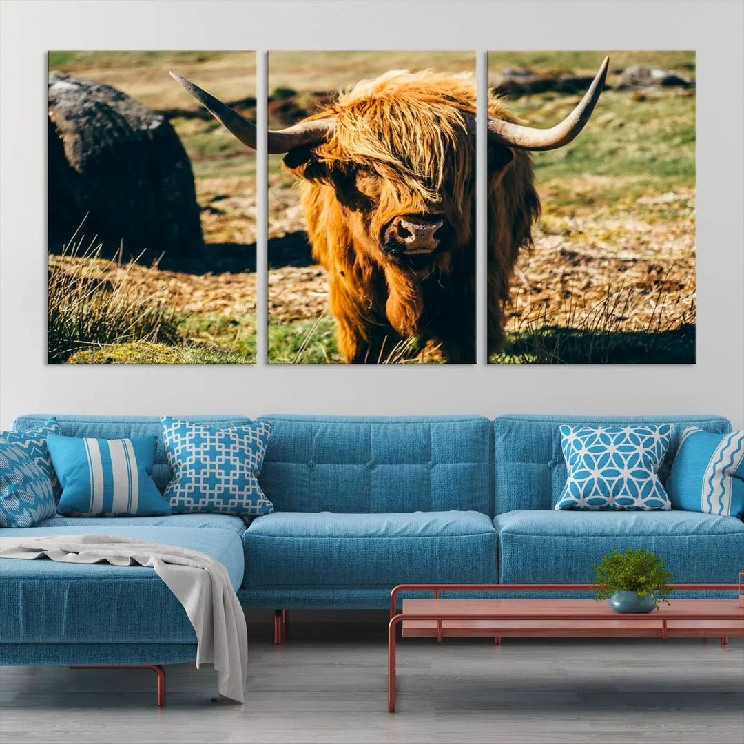 The living room features the Highland Cow Canvas Wall Art, a triptych printed on museum-quality canvas, displayed gracefully above.