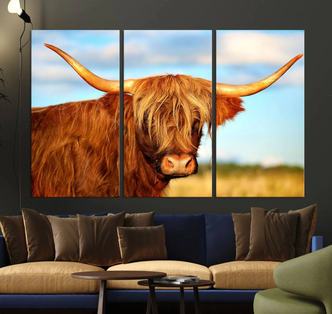 A triptych of Highland Cow Canvas Wall Art Print Cattle Art, featuring a shaggy-haired highland cow with long horns, elegantly adorns the space. Each museum-quality canvas piece is professionally hand-assembled and includes a UV-protective coating to maintain its vibrant colors over time.