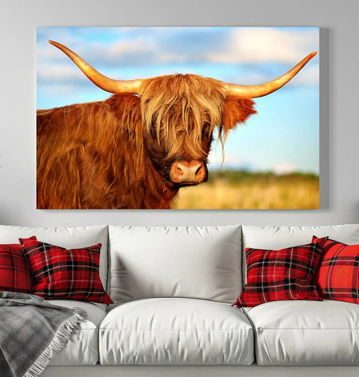 A triptych of Highland Cow Canvas Wall Art Print Cattle Art, featuring a shaggy-haired highland cow with long horns, elegantly adorns the space. Each museum-quality canvas piece is professionally hand-assembled and includes a UV-protective coating to maintain its vibrant colors over time.