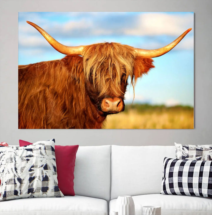 A triptych of Highland Cow Canvas Wall Art Print Cattle Art, featuring a shaggy-haired highland cow with long horns, elegantly adorns the space. Each museum-quality canvas piece is professionally hand-assembled and includes a UV-protective coating to maintain its vibrant colors over time.