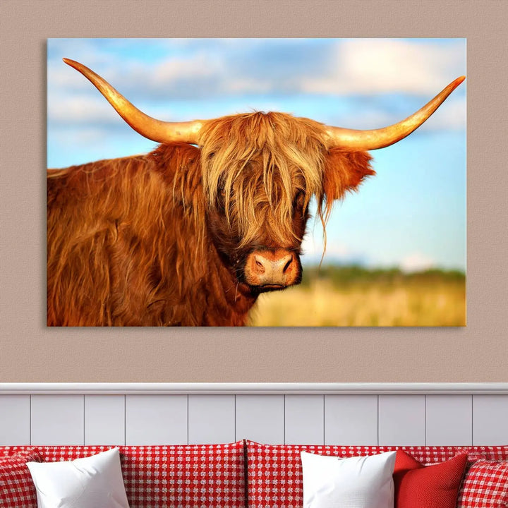 A triptych of Highland Cow Canvas Wall Art Print Cattle Art, featuring a shaggy-haired highland cow with long horns, elegantly adorns the space. Each museum-quality canvas piece is professionally hand-assembled and includes a UV-protective coating to maintain its vibrant colors over time.