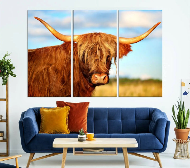 A triptych of Highland Cow Canvas Wall Art Print Cattle Art, featuring a shaggy-haired highland cow with long horns, elegantly adorns the space. Each museum-quality canvas piece is professionally hand-assembled and includes a UV-protective coating to maintain its vibrant colors over time.