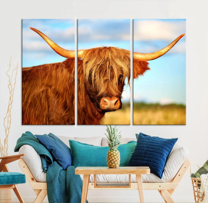 A triptych of Highland Cow Canvas Wall Art Print Cattle Art, featuring a shaggy-haired highland cow with long horns, elegantly adorns the space. Each museum-quality canvas piece is professionally hand-assembled and includes a UV-protective coating to maintain its vibrant colors over time.