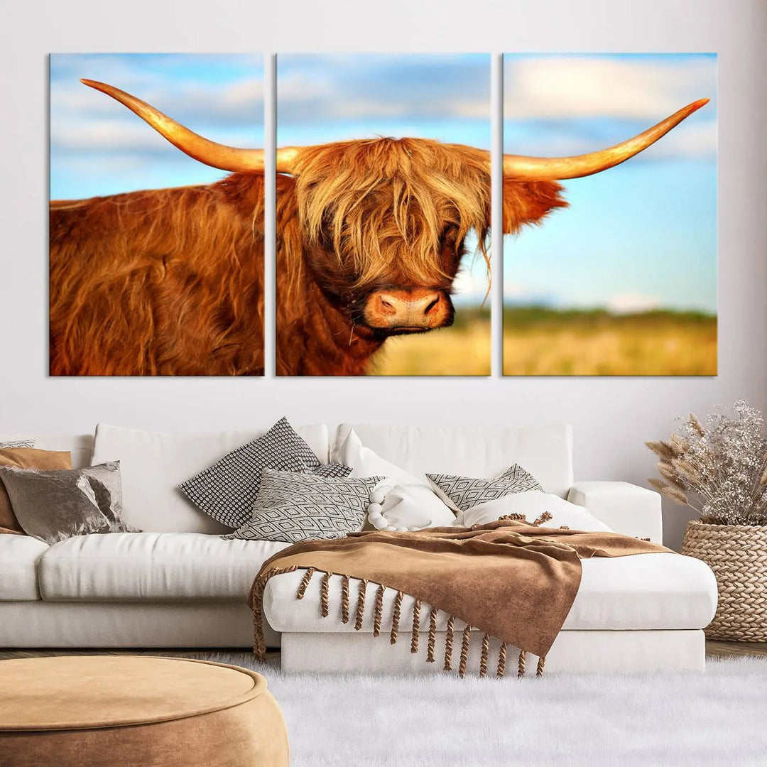 A triptych of Highland Cow Canvas Wall Art Print Cattle Art, featuring a shaggy-haired highland cow with long horns, elegantly adorns the space. Each museum-quality canvas piece is professionally hand-assembled and includes a UV-protective coating to maintain its vibrant colors over time.