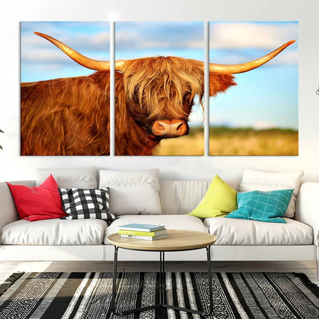 A triptych of Highland Cow Canvas Wall Art Print Cattle Art, featuring a shaggy-haired highland cow with long horns, elegantly adorns the space. Each museum-quality canvas piece is professionally hand-assembled and includes a UV-protective coating to maintain its vibrant colors over time.