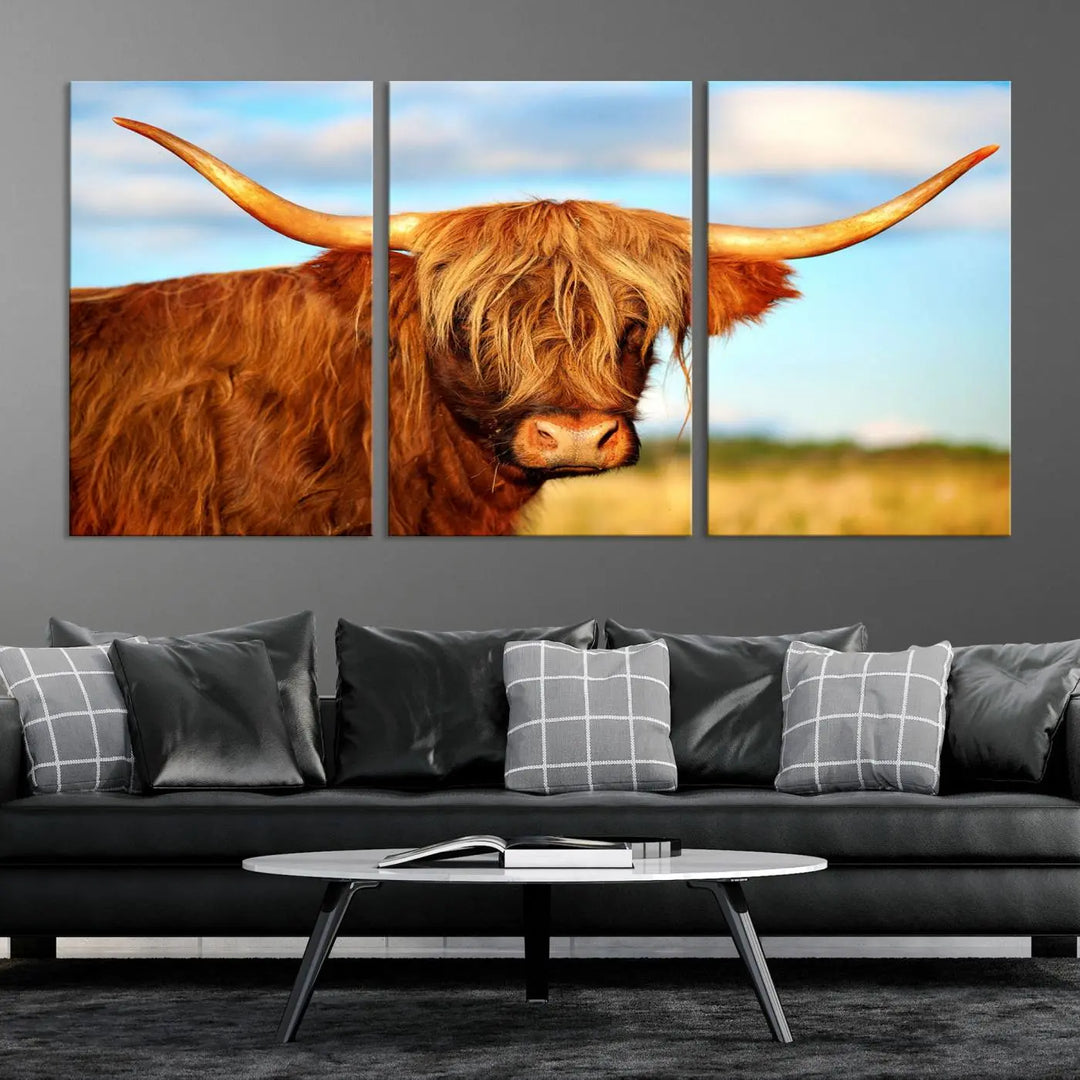 A triptych of Highland Cow Canvas Wall Art Print Cattle Art, featuring a shaggy-haired highland cow with long horns, elegantly adorns the space. Each museum-quality canvas piece is professionally hand-assembled and includes a UV-protective coating to maintain its vibrant colors over time.