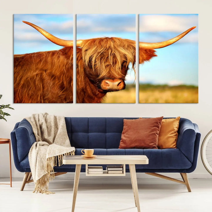 A triptych of Highland Cow Canvas Wall Art Print Cattle Art, featuring a shaggy-haired highland cow with long horns, elegantly adorns the space. Each museum-quality canvas piece is professionally hand-assembled and includes a UV-protective coating to maintain its vibrant colors over time.