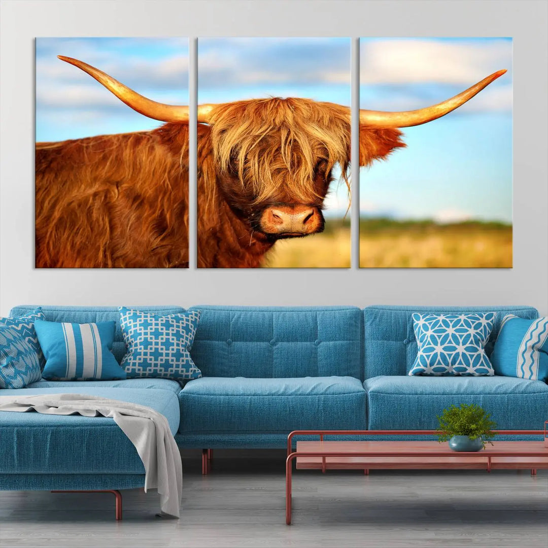 A triptych of Highland Cow Canvas Wall Art Print Cattle Art, featuring a shaggy-haired highland cow with long horns, elegantly adorns the space. Each museum-quality canvas piece is professionally hand-assembled and includes a UV-protective coating to maintain its vibrant colors over time.