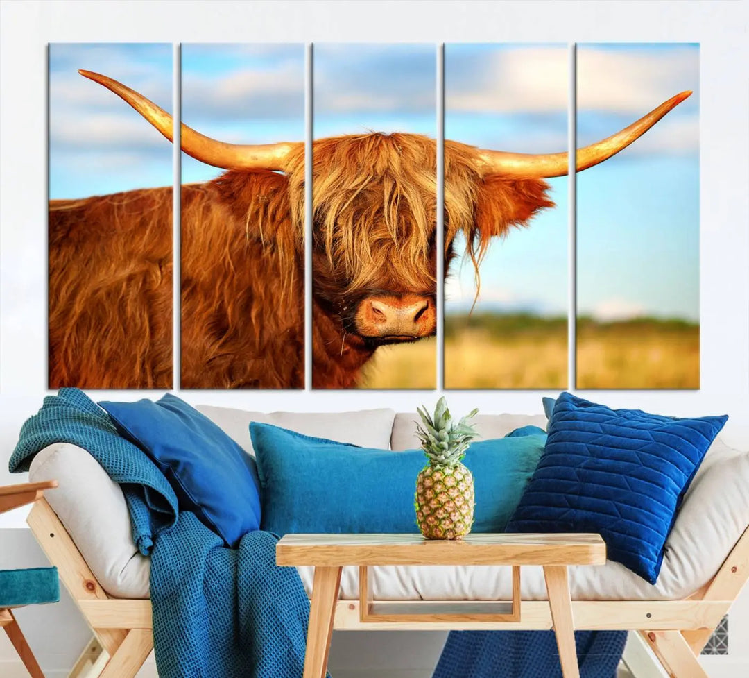 A triptych of Highland Cow Canvas Wall Art Print Cattle Art, featuring a shaggy-haired highland cow with long horns, elegantly adorns the space. Each museum-quality canvas piece is professionally hand-assembled and includes a UV-protective coating to maintain its vibrant colors over time.