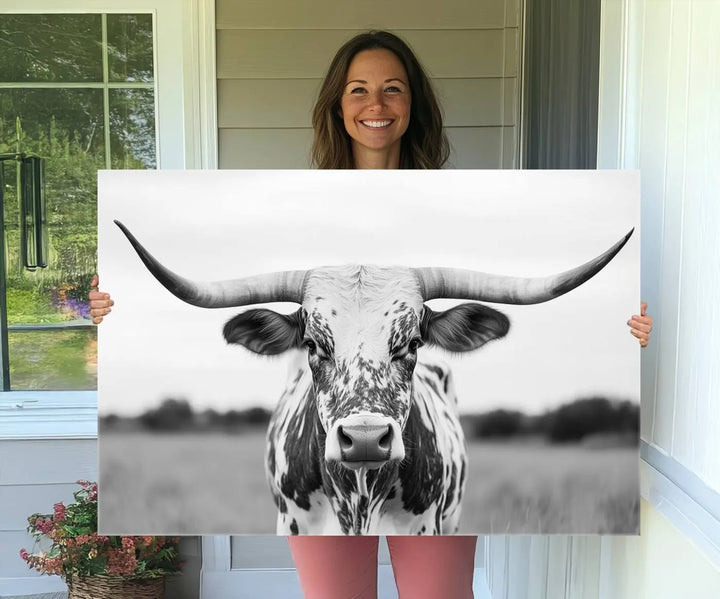 The Highland Cow Wall Art - Black & White Longhorn Canvas Print elevates farmhouse decor with its striking presence.