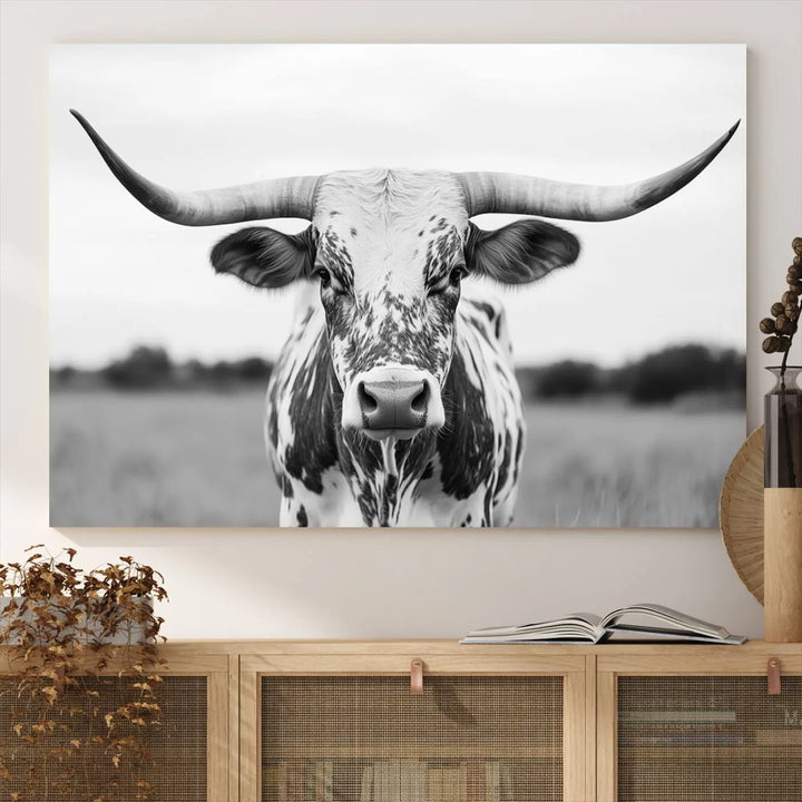 The Highland Cow Wall Art - Black & White Longhorn Canvas Print elevates farmhouse decor with its striking presence.