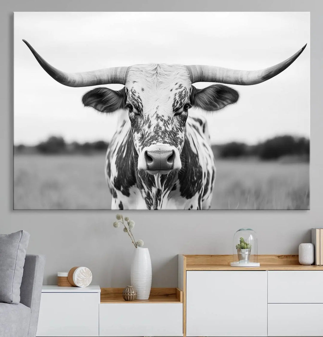 The Highland Cow Wall Art - Black & White Longhorn Canvas Print elevates farmhouse decor with its striking presence.