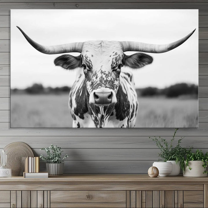 The Highland Cow Wall Art - Black & White Longhorn Canvas Print elevates farmhouse decor with its striking presence.