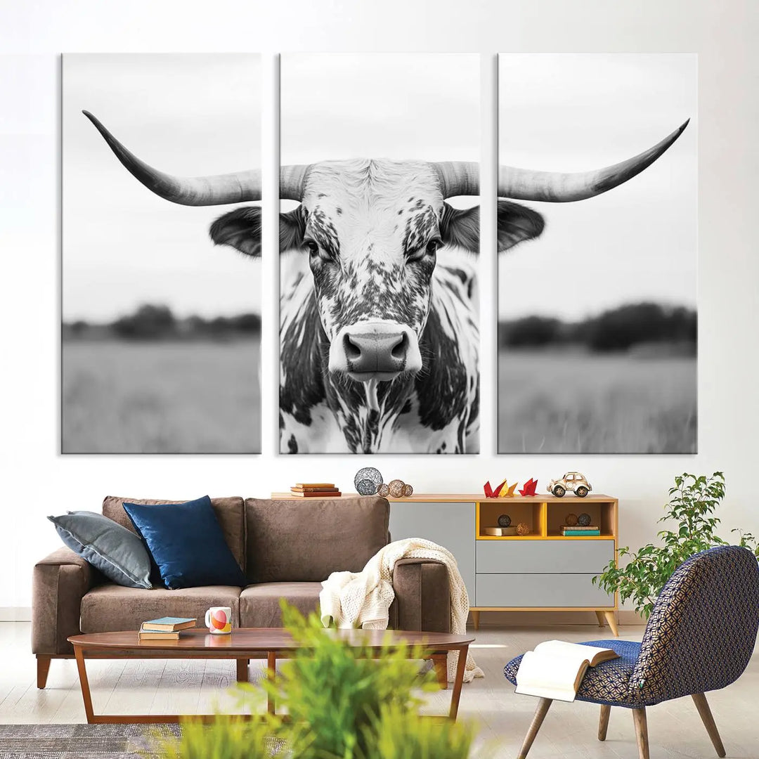 The Highland Cow Wall Art - Black & White Longhorn Canvas Print elevates farmhouse decor with its striking presence.