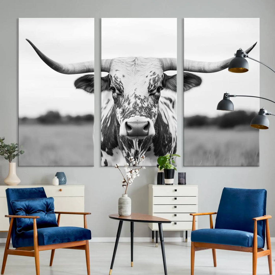 The Highland Cow Wall Art - Black & White Longhorn Canvas Print elevates farmhouse decor with its striking presence.