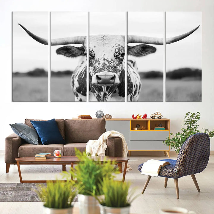 The Highland Cow Wall Art - Black & White Longhorn Canvas Print elevates farmhouse decor with its striking presence.