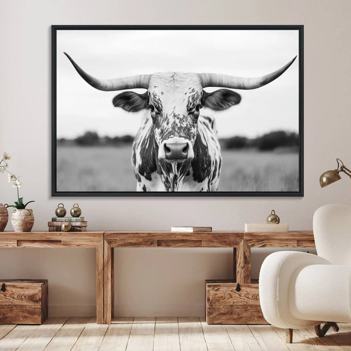 The Highland Cow Wall Art - Black & White Longhorn Canvas Print elevates farmhouse decor with its striking presence.