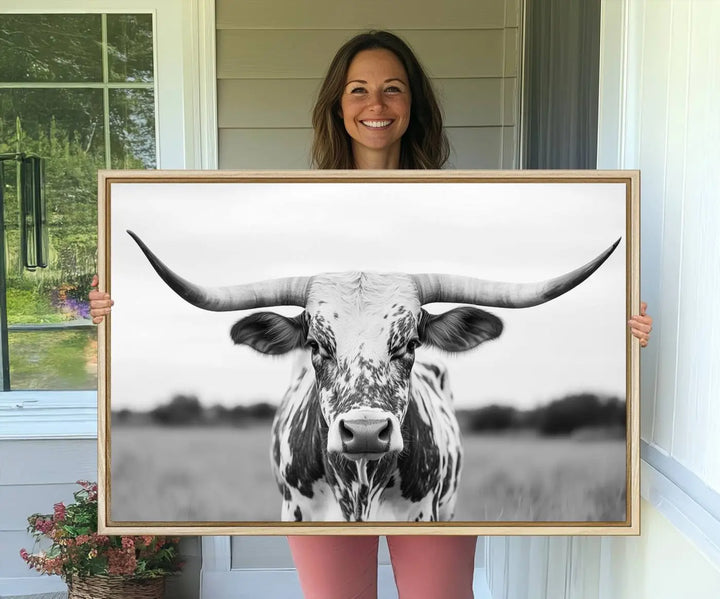 The Highland Cow Wall Art - Black & White Longhorn Canvas Print elevates farmhouse decor with its striking presence.