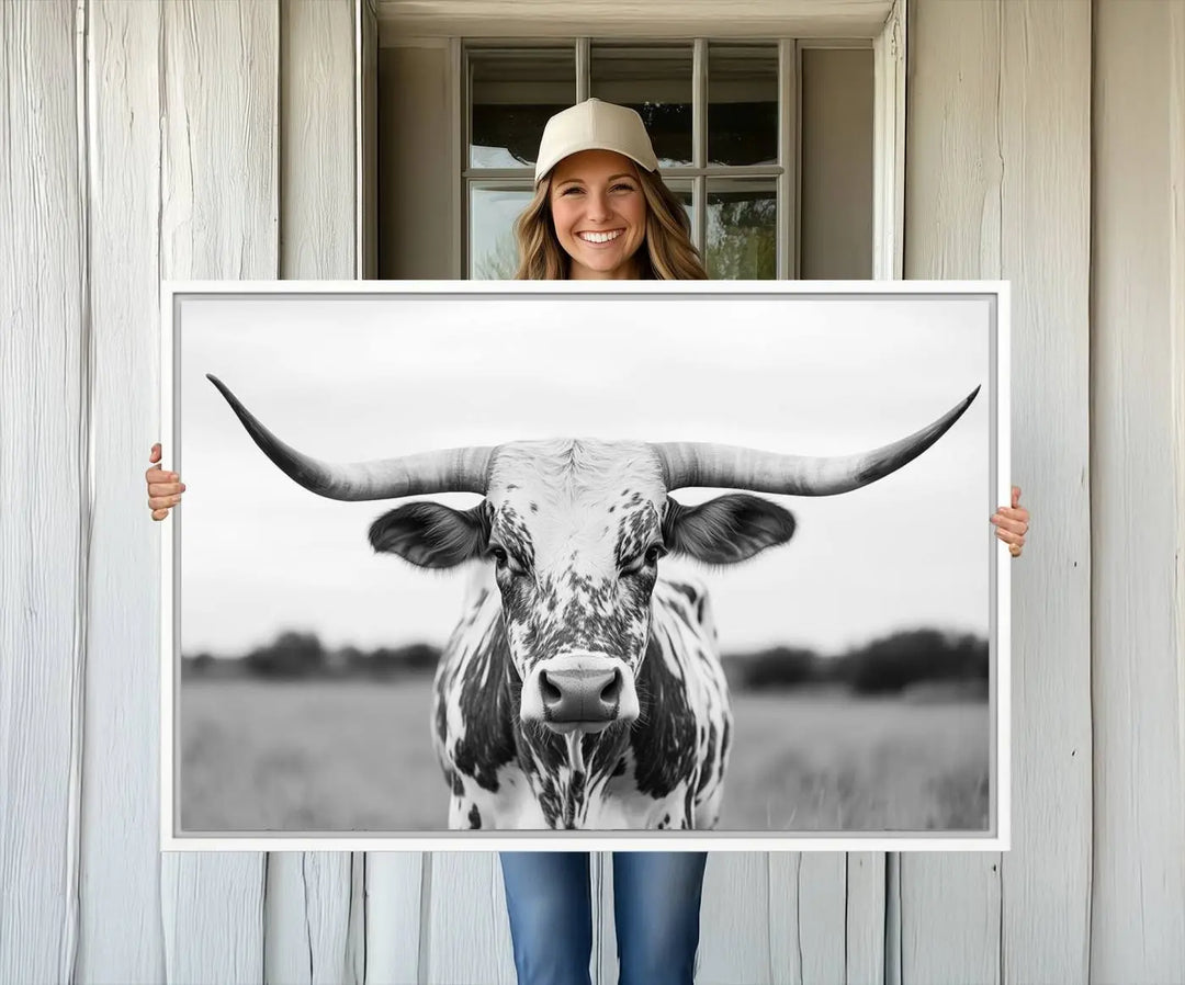 The Highland Cow Wall Art - Black & White Longhorn Canvas Print elevates farmhouse decor with its striking presence.