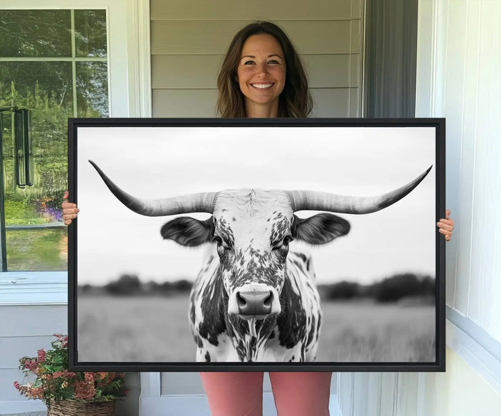 The Highland Cow Wall Art - Black & White Longhorn Canvas Print elevates farmhouse decor with its striking presence.