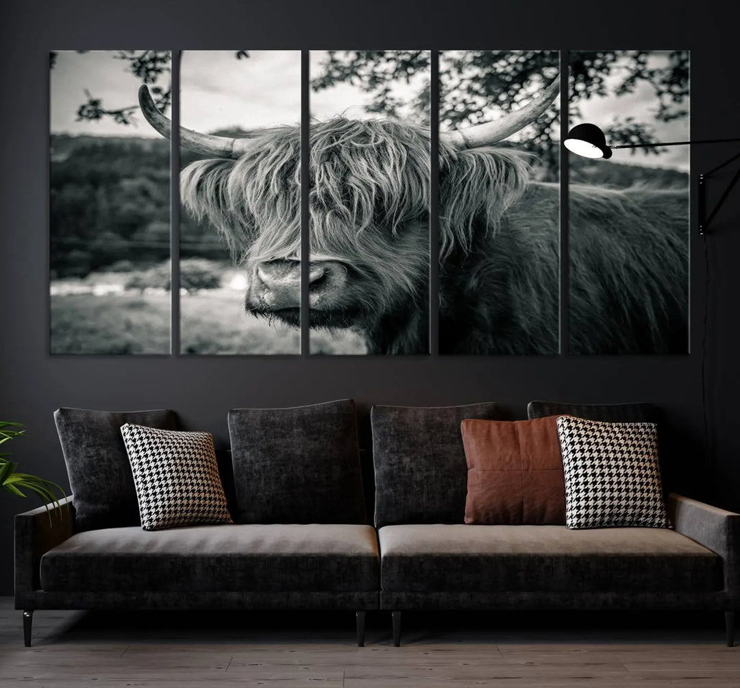 The stylish living room showcases the "Highland Cow Wall Art Canvas Print Scottish Cattle Canvas Art" displayed as a triptych on the wall. This artwork is gallery wrapped on museum-quality canvas with a UV-protective coating for lasting elegance.