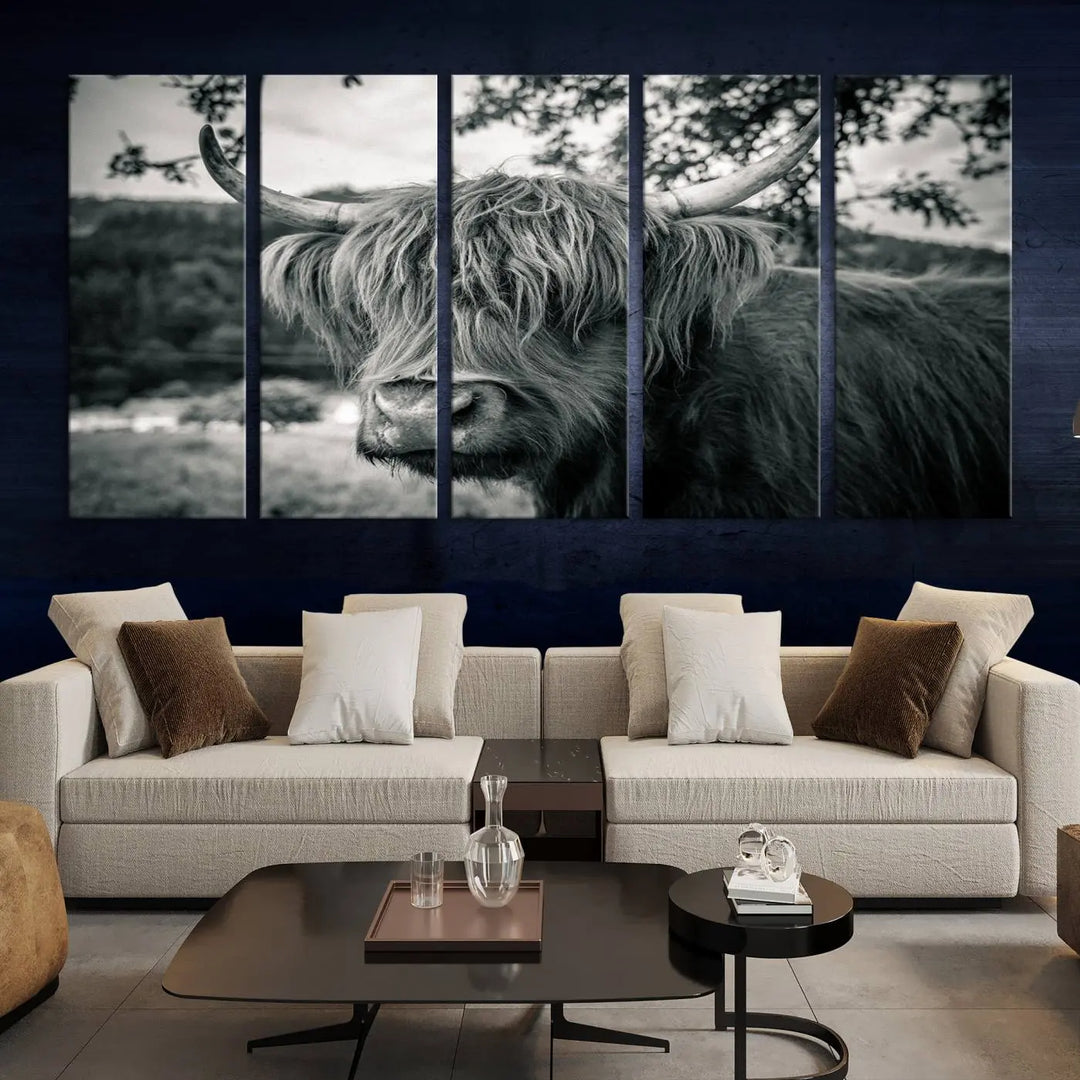 The stylish living room showcases the "Highland Cow Wall Art Canvas Print Scottish Cattle Canvas Art" displayed as a triptych on the wall. This artwork is gallery wrapped on museum-quality canvas with a UV-protective coating for lasting elegance.