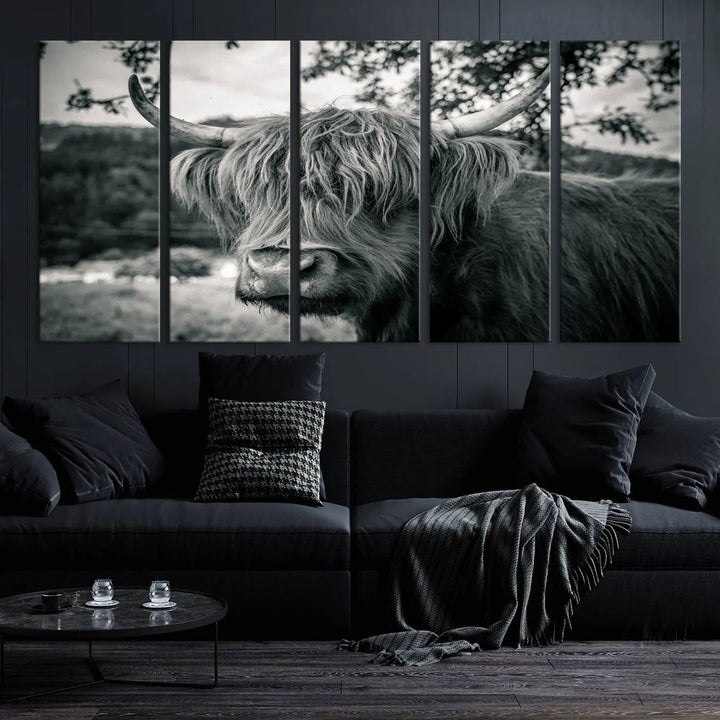 The stylish living room showcases the "Highland Cow Wall Art Canvas Print Scottish Cattle Canvas Art" displayed as a triptych on the wall. This artwork is gallery wrapped on museum-quality canvas with a UV-protective coating for lasting elegance.