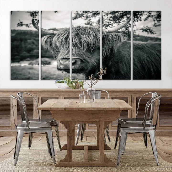 The stylish living room showcases the "Highland Cow Wall Art Canvas Print Scottish Cattle Canvas Art" displayed as a triptych on the wall. This artwork is gallery wrapped on museum-quality canvas with a UV-protective coating for lasting elegance.