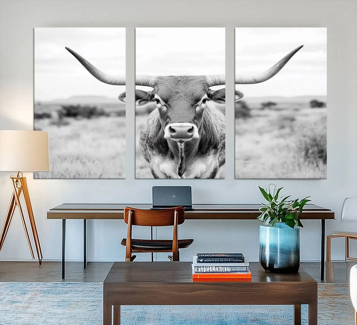 The "Highland Cow Wall Art Print," featuring a black and white depiction of a Texas Western Longhorn, elegantly adorns the wall. This Southwestern animal artwork for home is crafted as premium canvas wall art, ensuring a gallery-quality finish.