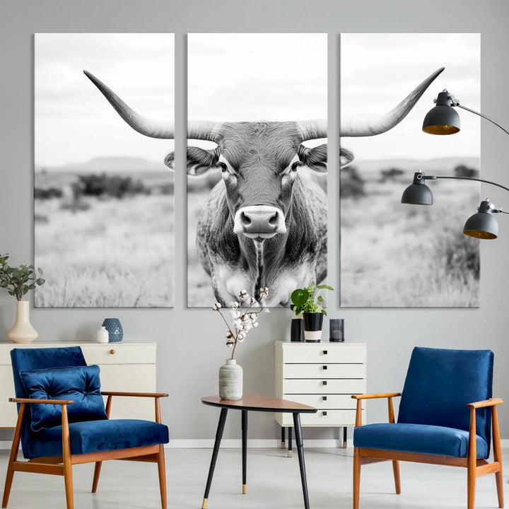 The "Highland Cow Wall Art Print," featuring a black and white depiction of a Texas Western Longhorn, elegantly adorns the wall. This Southwestern animal artwork for home is crafted as premium canvas wall art, ensuring a gallery-quality finish.