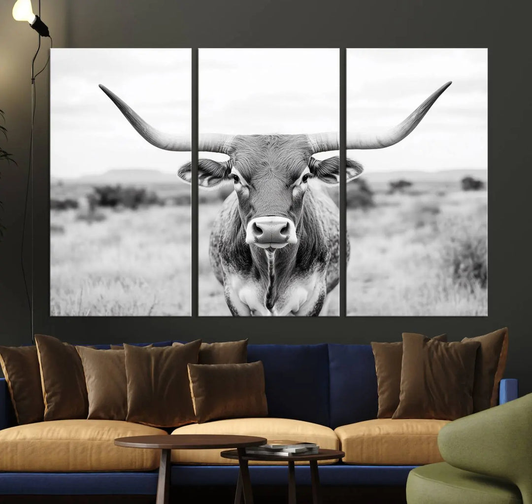 The "Highland Cow Wall Art Print," featuring a black and white depiction of a Texas Western Longhorn, elegantly adorns the wall. This Southwestern animal artwork for home is crafted as premium canvas wall art, ensuring a gallery-quality finish.