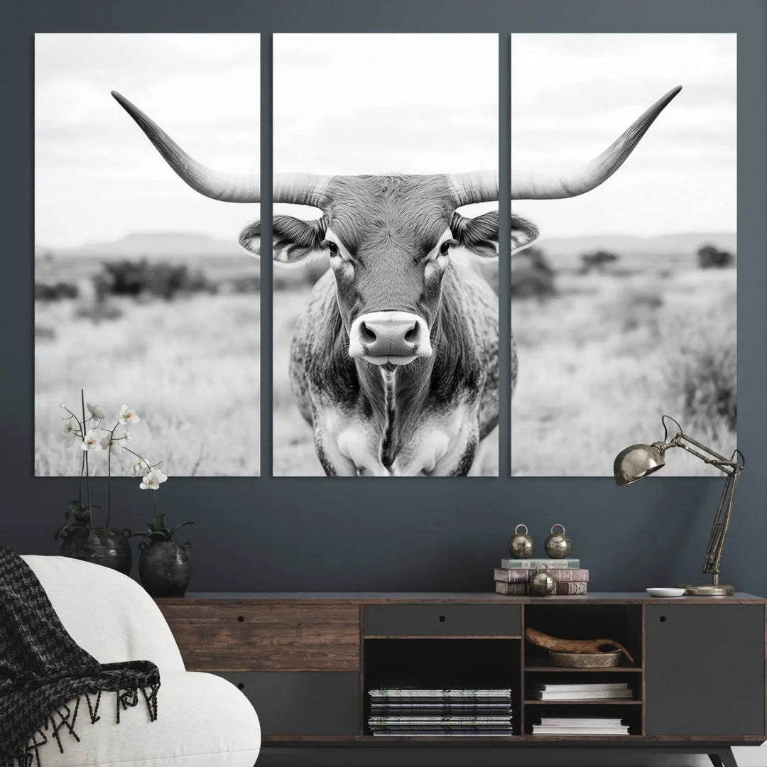 The "Highland Cow Wall Art Print," featuring a black and white depiction of a Texas Western Longhorn, elegantly adorns the wall. This Southwestern animal artwork for home is crafted as premium canvas wall art, ensuring a gallery-quality finish.