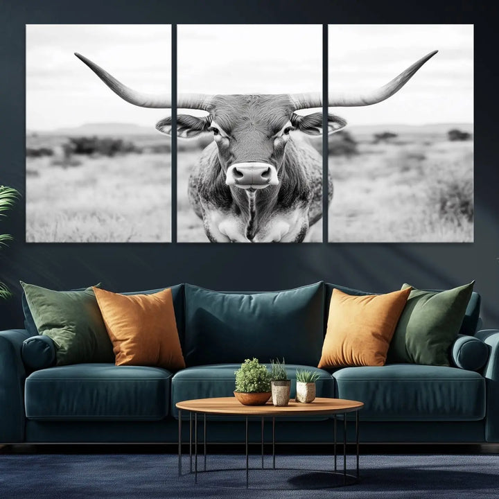 The "Highland Cow Wall Art Print," featuring a black and white depiction of a Texas Western Longhorn, elegantly adorns the wall. This Southwestern animal artwork for home is crafted as premium canvas wall art, ensuring a gallery-quality finish.