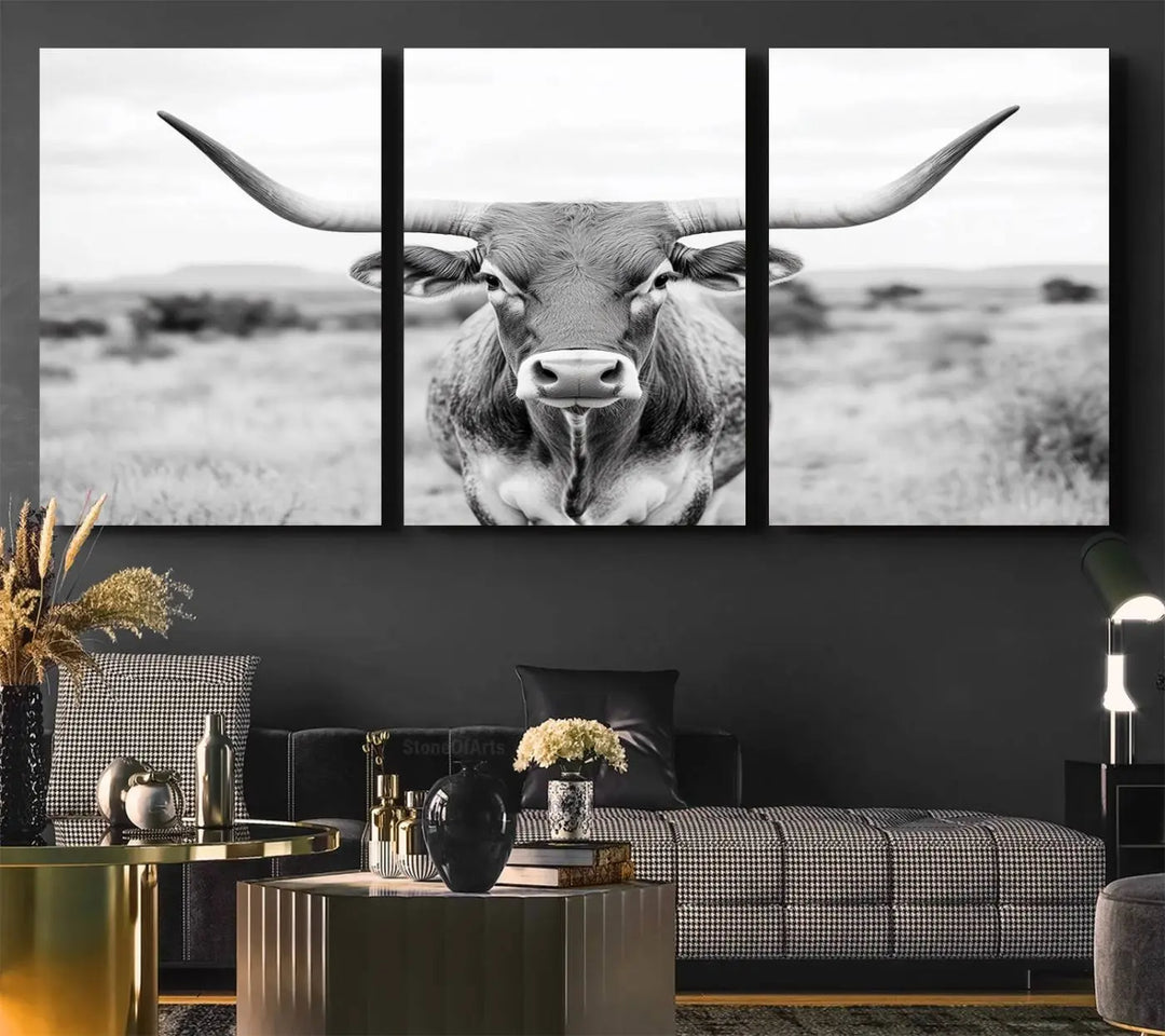 The "Highland Cow Wall Art Print," featuring a black and white depiction of a Texas Western Longhorn, elegantly adorns the wall. This Southwestern animal artwork for home is crafted as premium canvas wall art, ensuring a gallery-quality finish.