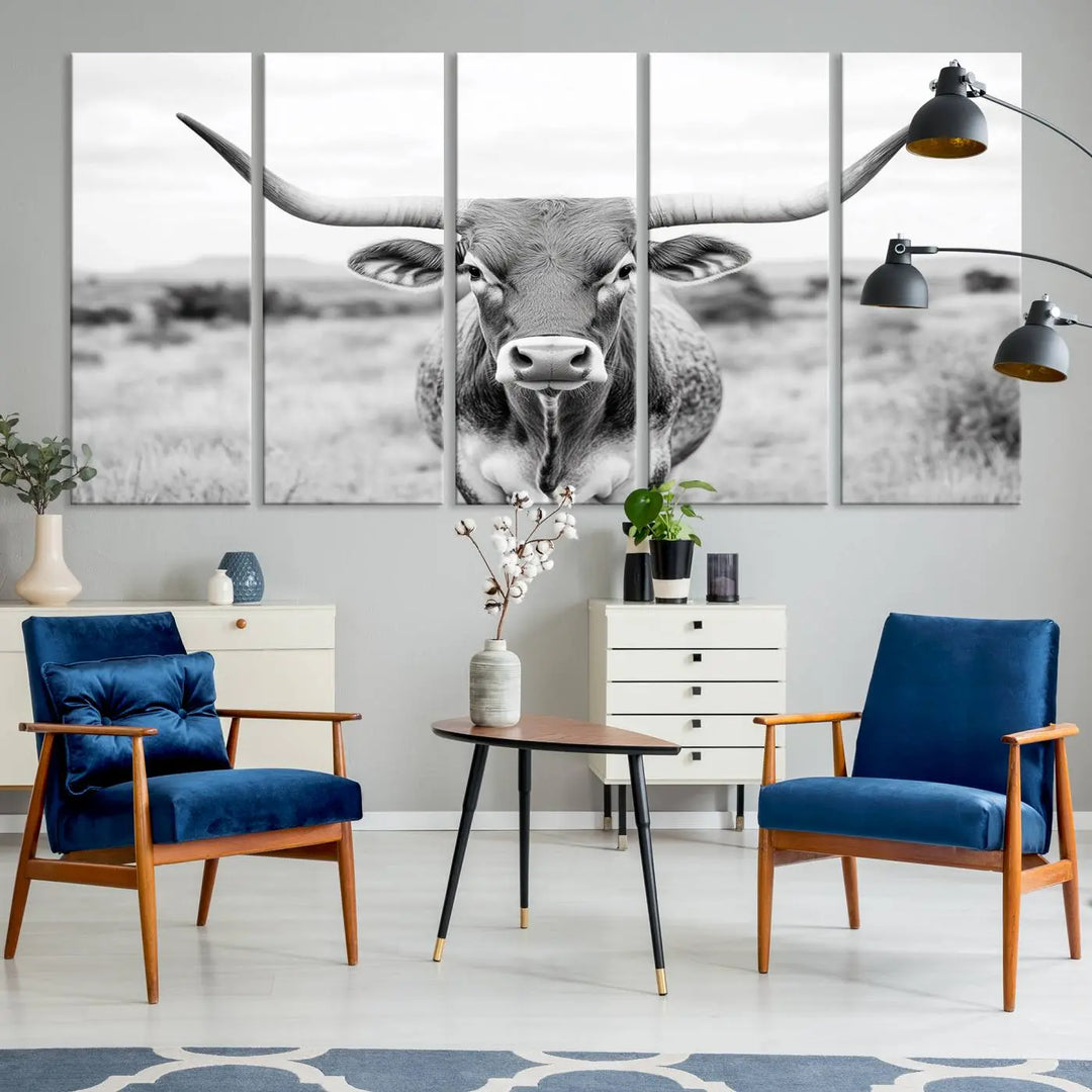 The "Highland Cow Wall Art Print," featuring a black and white depiction of a Texas Western Longhorn, elegantly adorns the wall. This Southwestern animal artwork for home is crafted as premium canvas wall art, ensuring a gallery-quality finish.