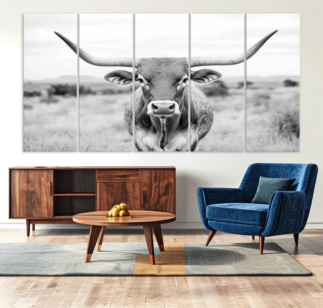 The "Highland Cow Wall Art Print," featuring a black and white depiction of a Texas Western Longhorn, elegantly adorns the wall. This Southwestern animal artwork for home is crafted as premium canvas wall art, ensuring a gallery-quality finish.