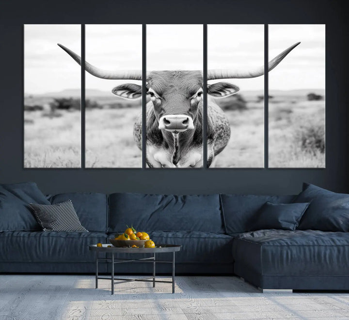 The "Highland Cow Wall Art Print," featuring a black and white depiction of a Texas Western Longhorn, elegantly adorns the wall. This Southwestern animal artwork for home is crafted as premium canvas wall art, ensuring a gallery-quality finish.