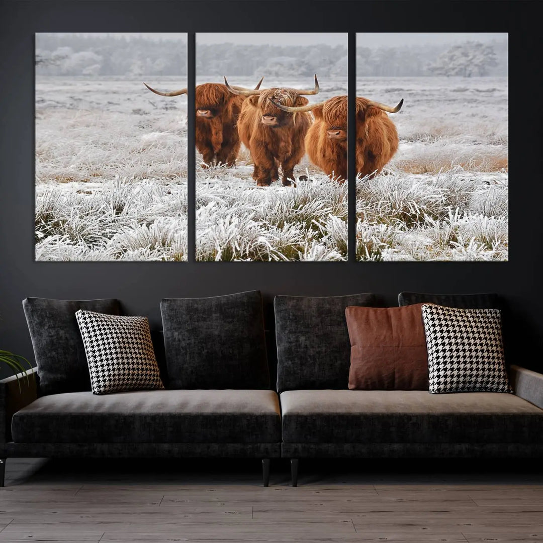 The "Highland Cows in Snow Canvas Art Highland Cattle Picture Art Farmhouse Art," featuring three highland cows walking through a frosty field, is printed on museum-quality canvas and gallery wrapped. It includes a UV-protective coating to ensure lasting beauty.