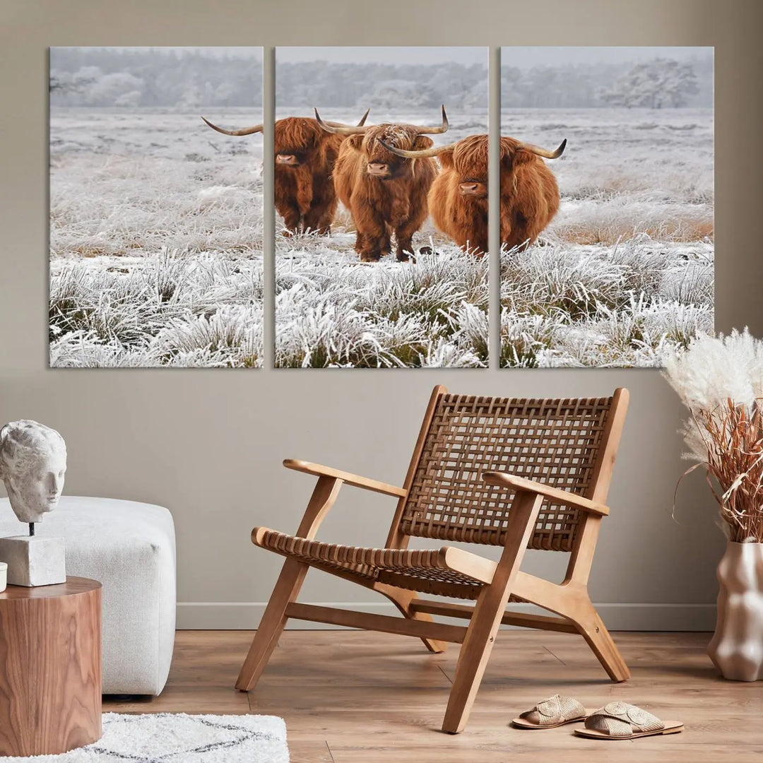 The "Highland Cows in Snow Canvas Art Highland Cattle Picture Art Farmhouse Art," featuring three highland cows walking through a frosty field, is printed on museum-quality canvas and gallery wrapped. It includes a UV-protective coating to ensure lasting beauty.