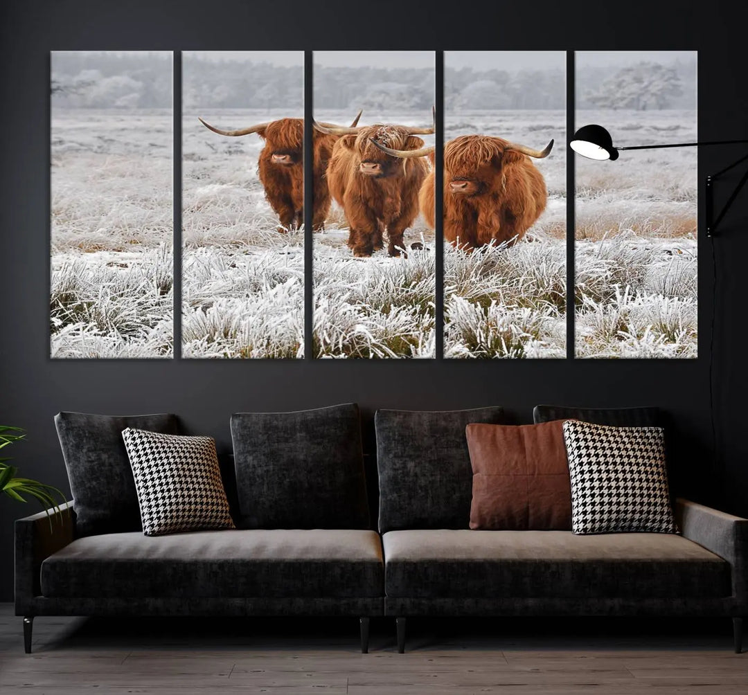 The "Highland Cows in Snow Canvas Art Highland Cattle Picture Art Farmhouse Art," featuring three highland cows walking through a frosty field, is printed on museum-quality canvas and gallery wrapped. It includes a UV-protective coating to ensure lasting beauty.