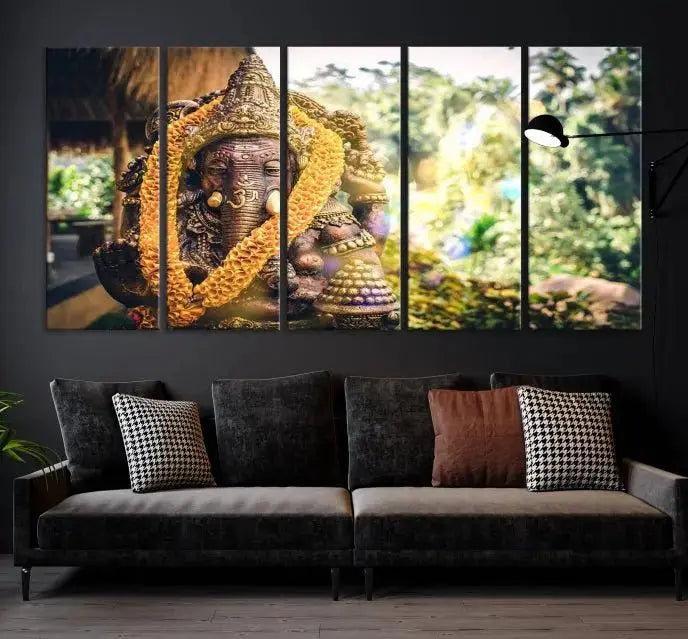 A set of three panels depicting the Hindu deity Lord Ganesha, embellished with a yellow garland, gracefully decorates a wall. This gallery-wrapped artwork, known as the Hinduism Statue Wall Art Canvas Print, is meticulously crafted on museum-quality canvas for an exquisite finish.