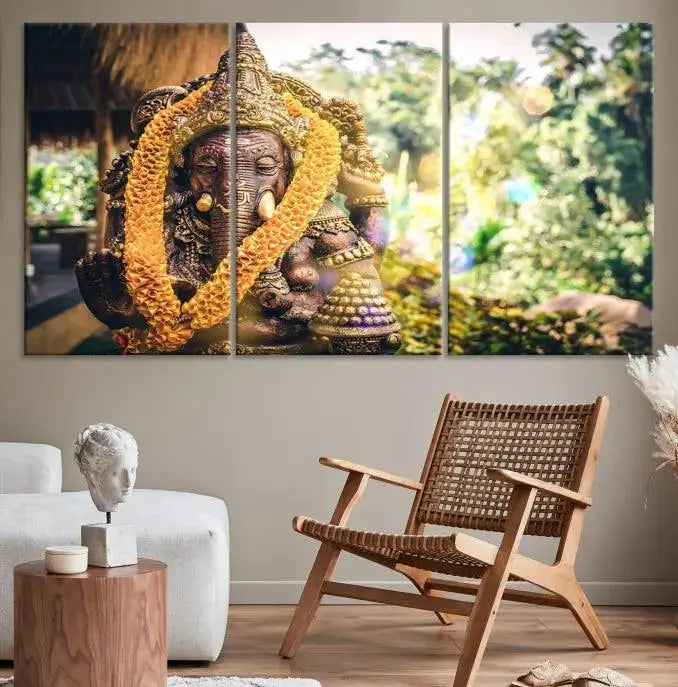 A set of three panels depicting the Hindu deity Lord Ganesha, embellished with a yellow garland, gracefully decorates a wall. This gallery-wrapped artwork, known as the Hinduism Statue Wall Art Canvas Print, is meticulously crafted on museum-quality canvas for an exquisite finish.