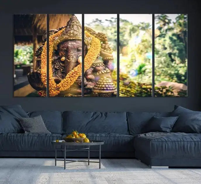 A set of three panels depicting the Hindu deity Lord Ganesha, embellished with a yellow garland, gracefully decorates a wall. This gallery-wrapped artwork, known as the Hinduism Statue Wall Art Canvas Print, is meticulously crafted on museum-quality canvas for an exquisite finish.