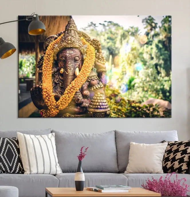 A set of three panels depicting the Hindu deity Lord Ganesha, embellished with a yellow garland, gracefully decorates a wall. This gallery-wrapped artwork, known as the Hinduism Statue Wall Art Canvas Print, is meticulously crafted on museum-quality canvas for an exquisite finish.