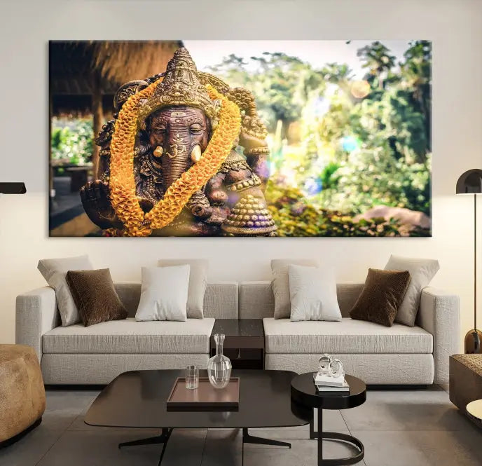 A set of three panels depicting the Hindu deity Lord Ganesha, embellished with a yellow garland, gracefully decorates a wall. This gallery-wrapped artwork, known as the Hinduism Statue Wall Art Canvas Print, is meticulously crafted on museum-quality canvas for an exquisite finish.