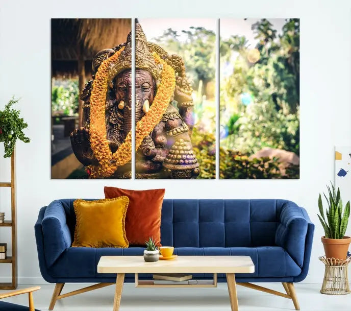 A set of three panels depicting the Hindu deity Lord Ganesha, embellished with a yellow garland, gracefully decorates a wall. This gallery-wrapped artwork, known as the Hinduism Statue Wall Art Canvas Print, is meticulously crafted on museum-quality canvas for an exquisite finish.