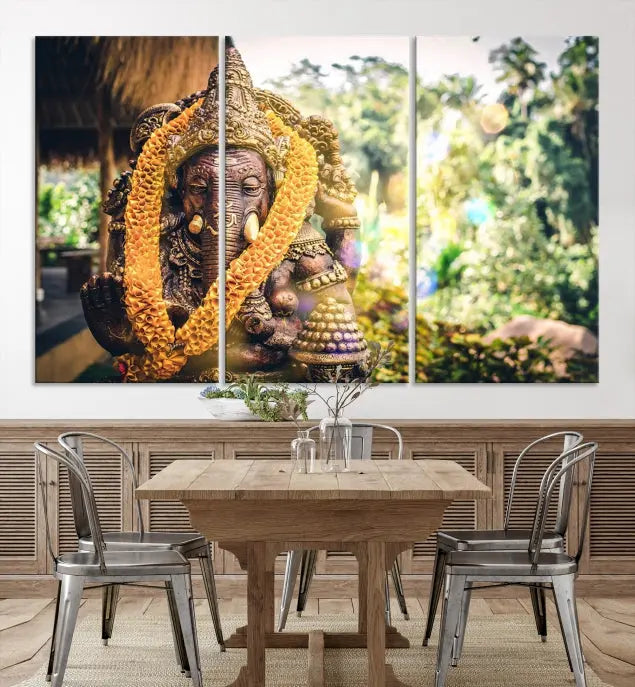 A set of three panels depicting the Hindu deity Lord Ganesha, embellished with a yellow garland, gracefully decorates a wall. This gallery-wrapped artwork, known as the Hinduism Statue Wall Art Canvas Print, is meticulously crafted on museum-quality canvas for an exquisite finish.