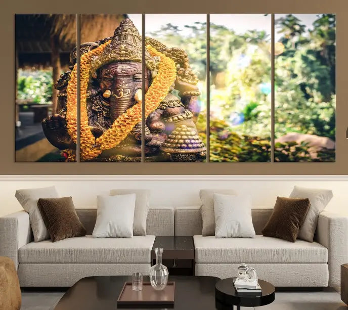 A set of three panels depicting the Hindu deity Lord Ganesha, embellished with a yellow garland, gracefully decorates a wall. This gallery-wrapped artwork, known as the Hinduism Statue Wall Art Canvas Print, is meticulously crafted on museum-quality canvas for an exquisite finish.