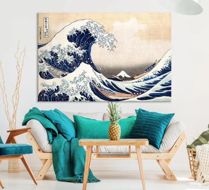 A triptych canvas print titled "Hokusai: The Breaking Wave off Kanagawa" in traditional Japanese style is elegantly displayed on museum-quality canvases with a UV-protective coating. Its blue and white hues are gallery wrapped, creating an artistic focal point.