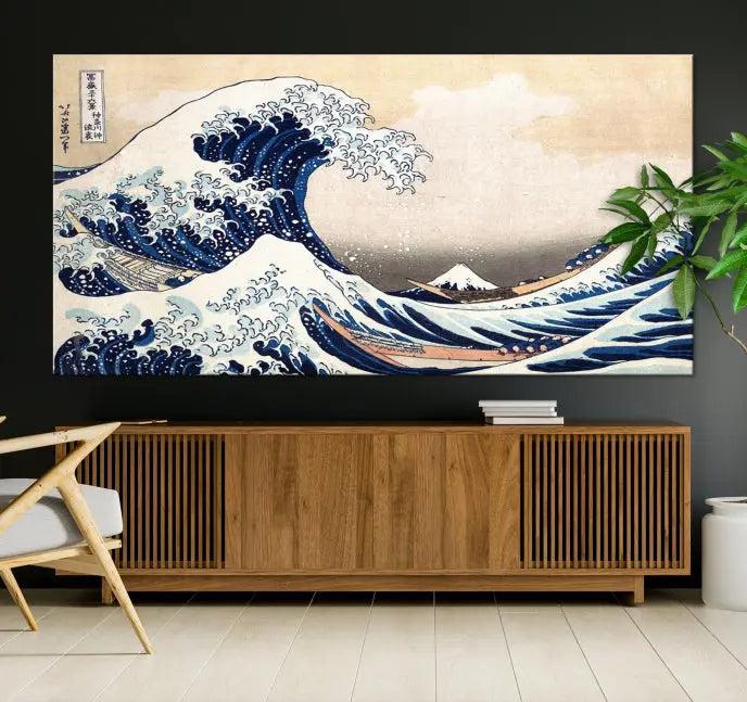 A triptych canvas print titled "Hokusai: The Breaking Wave off Kanagawa" in traditional Japanese style is elegantly displayed on museum-quality canvases with a UV-protective coating. Its blue and white hues are gallery wrapped, creating an artistic focal point.